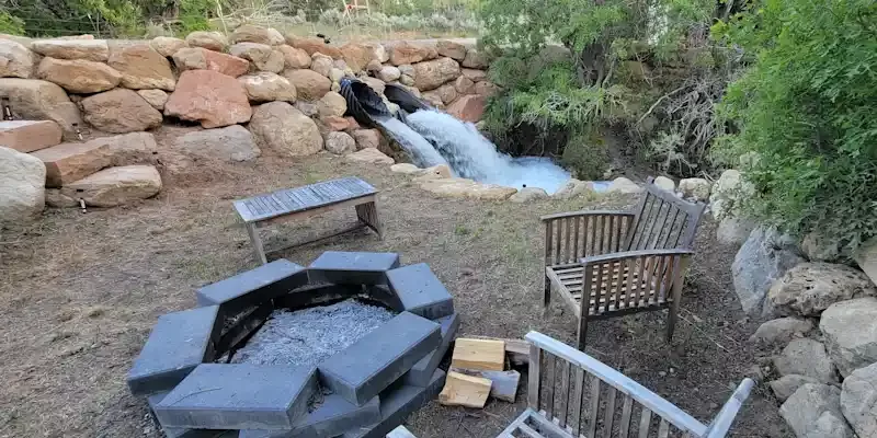 waterfall and firepit area